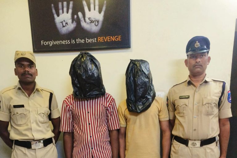Two Arrested, Principal Charged in Voyeurism Case